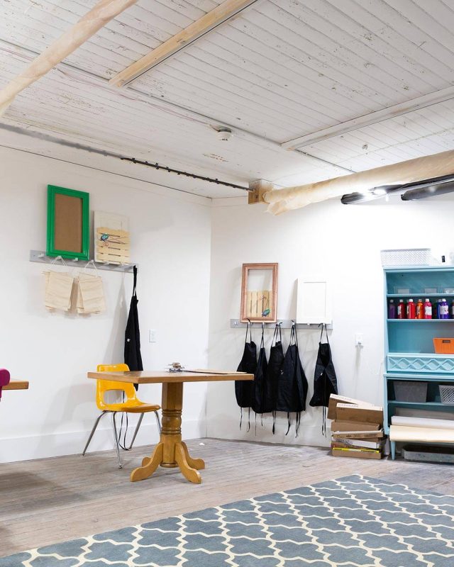 The Gathering Place: Colorful craft room with tables, chairs, and supplies.
